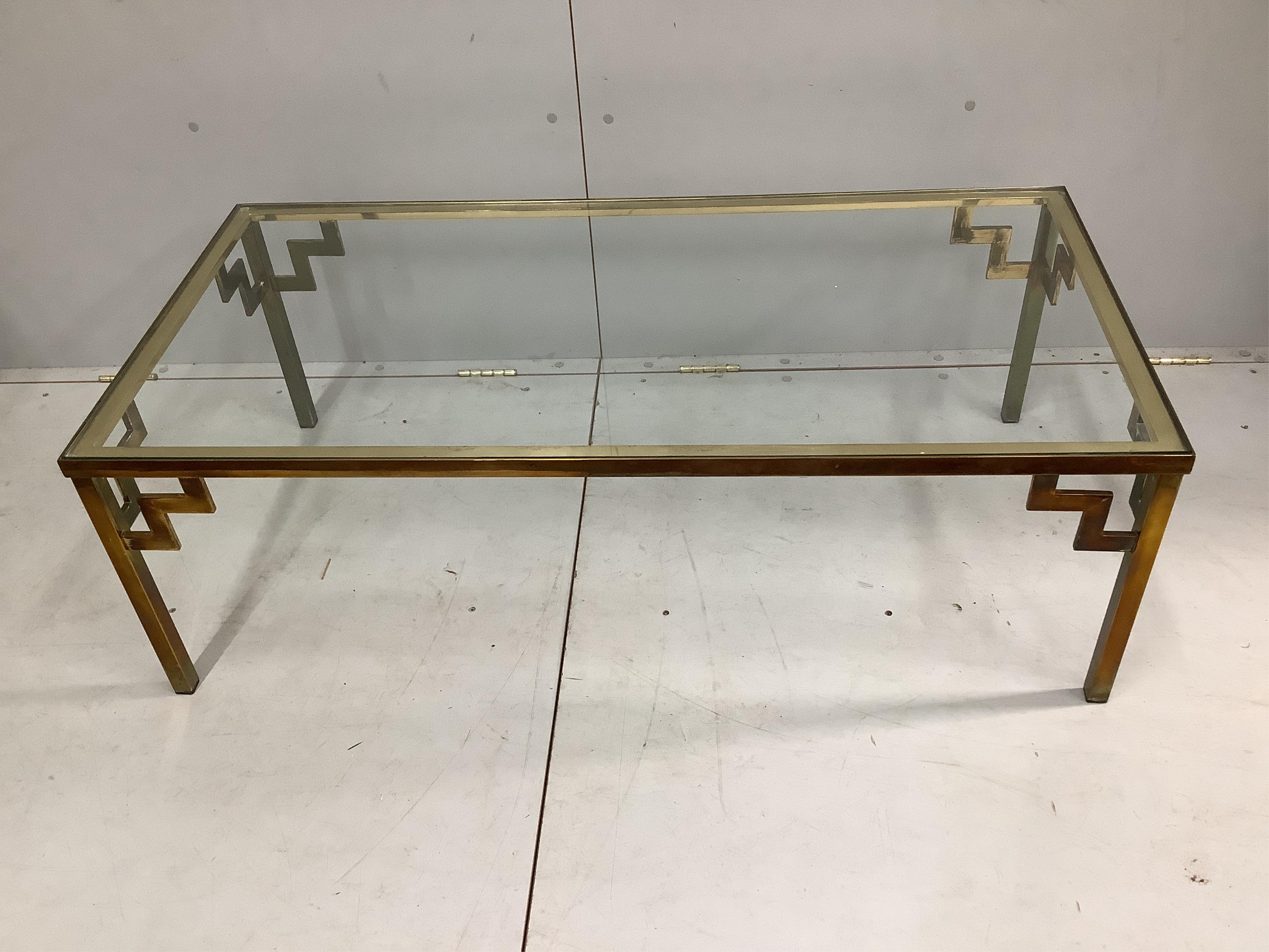 A pair of mid century brass and clear glass top coffee tables, width 122cm, depth 62cm, height 41cm. Condition - fair